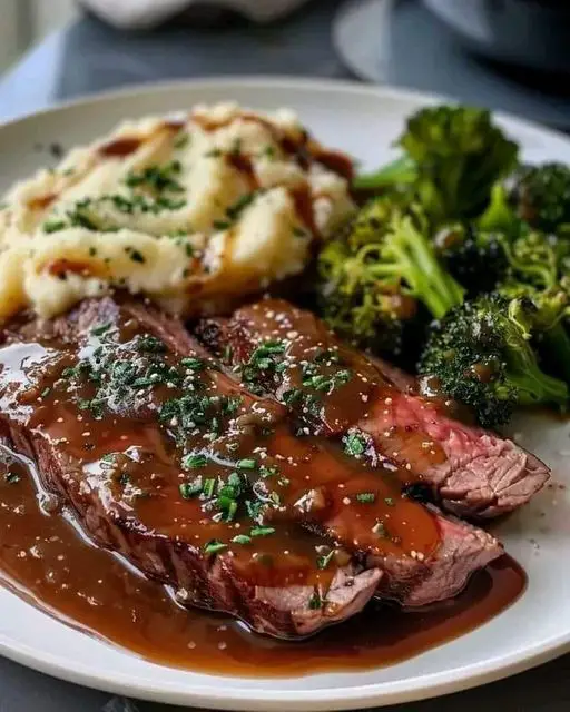 Grilled Steak with Garlic Mashed Potatoes, Steamed Broccoli, and Rich Gravy