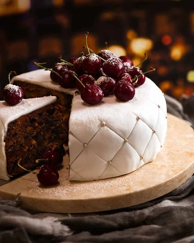 Christmas Cake decorated with fondant marzipan and cherries